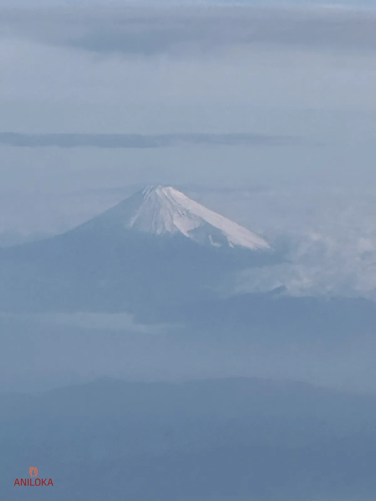 Mount Fuji View on Singapore Airlines Window after max zooming in Mount Fuji View on Singapore Airlines Window after max zooming in using iPhone 14 Pro
